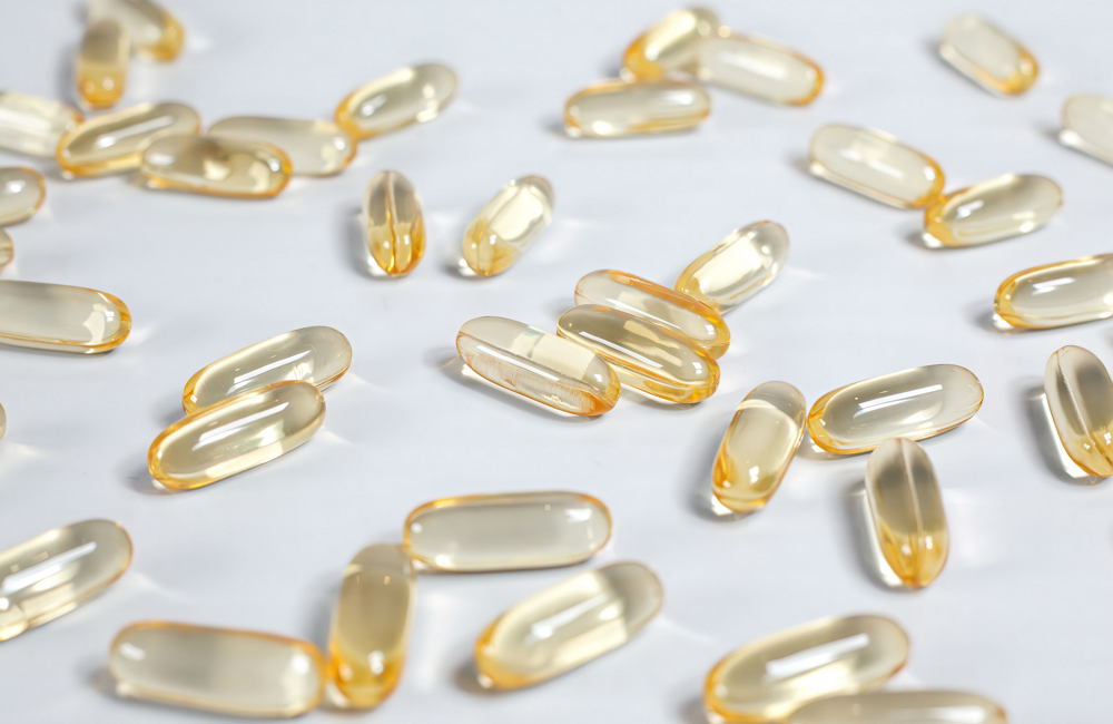 Softgel supplements on a white background